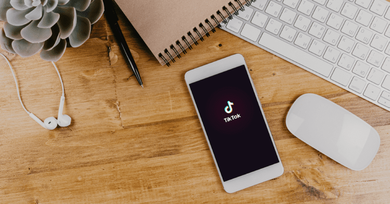 A mobile phone with the TikTok app opened on it.