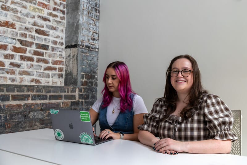 Madison and Abby working on a social media campaign.