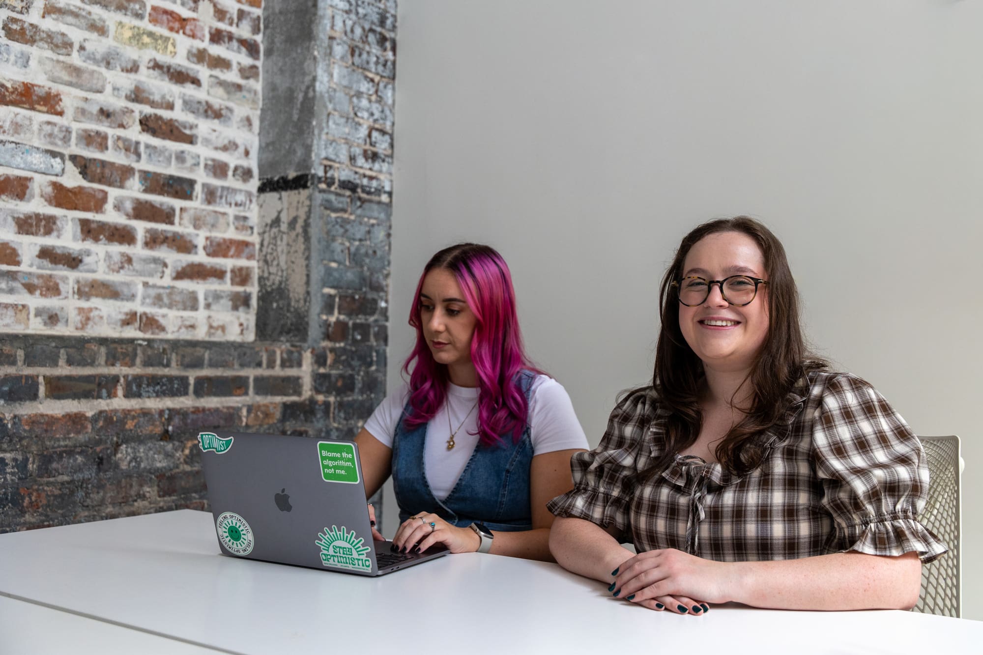 Madison and Abby working on a social media campaign.