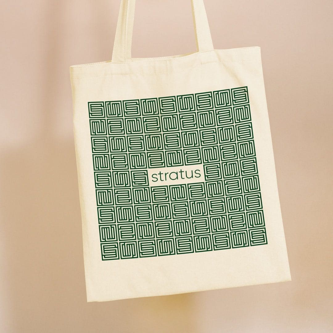 A tote bag with the Stratus logo and the interlocking "S" pattern.