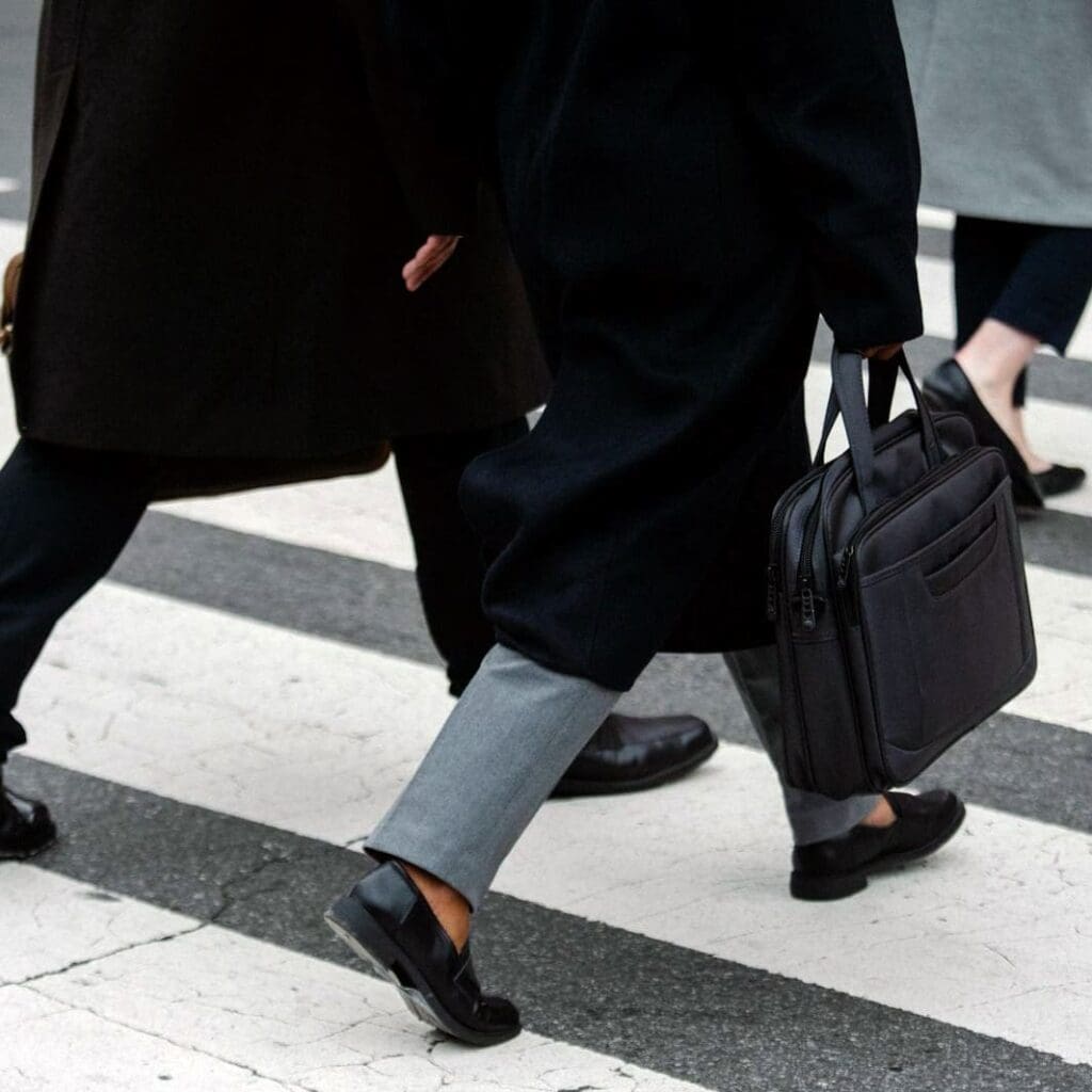 Business people walking across a crosswalk