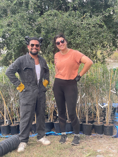 Two Optimists at a tree planting volunteer event