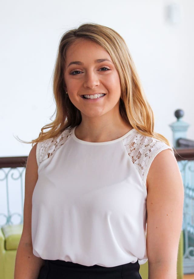 Young woman smiles at camera