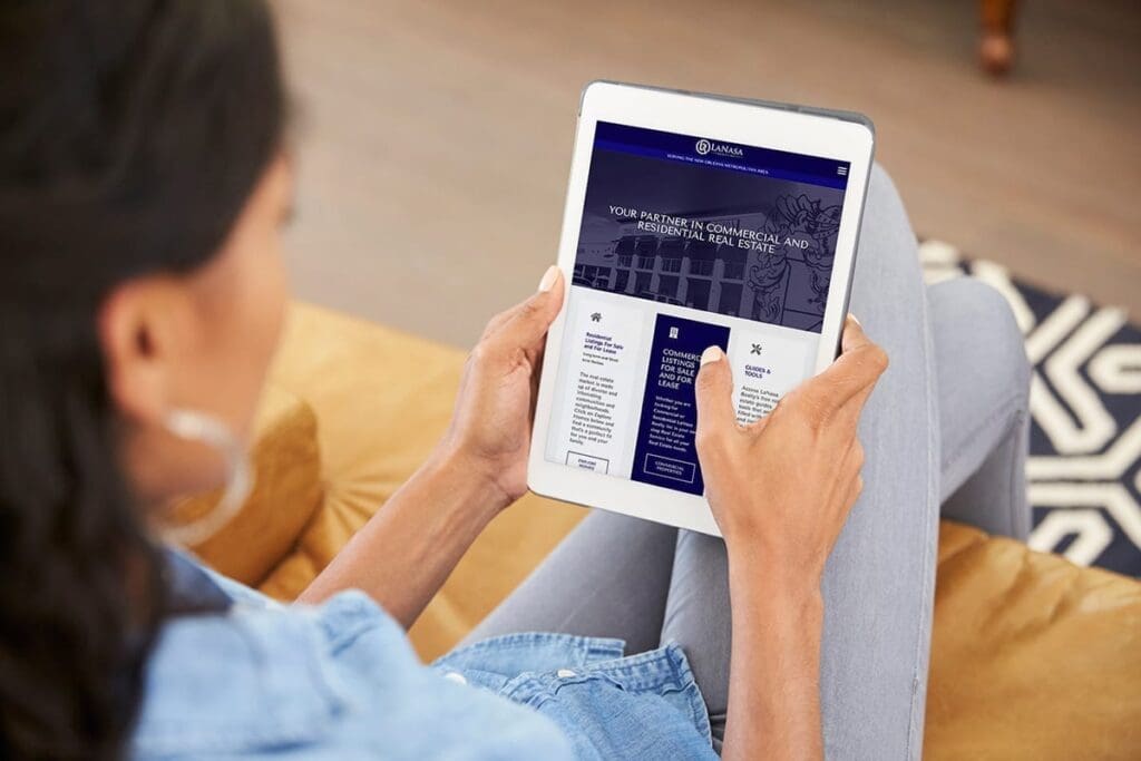 Woman uses LaNasa Realty's new website on a tablet