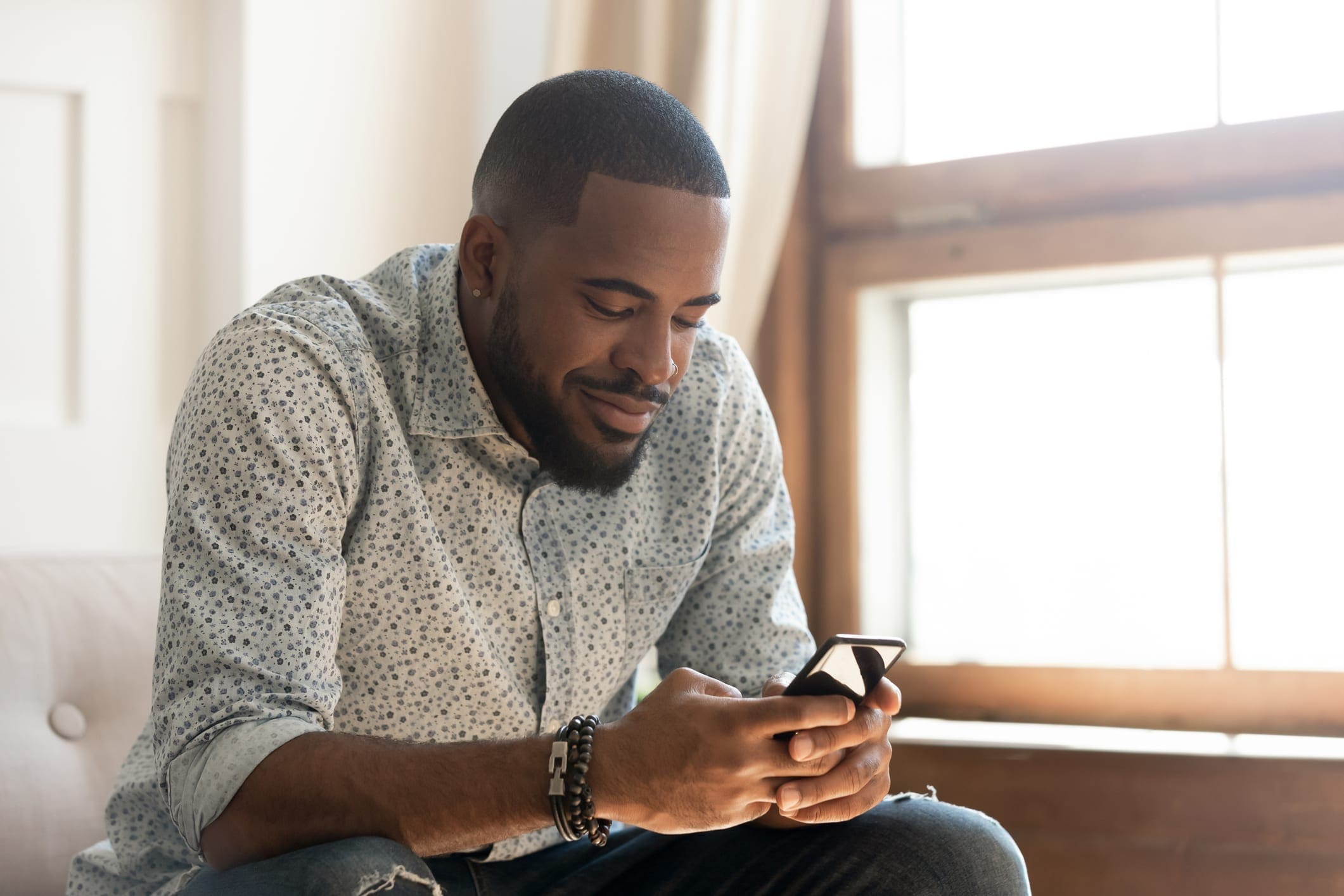 African American man using smartphone