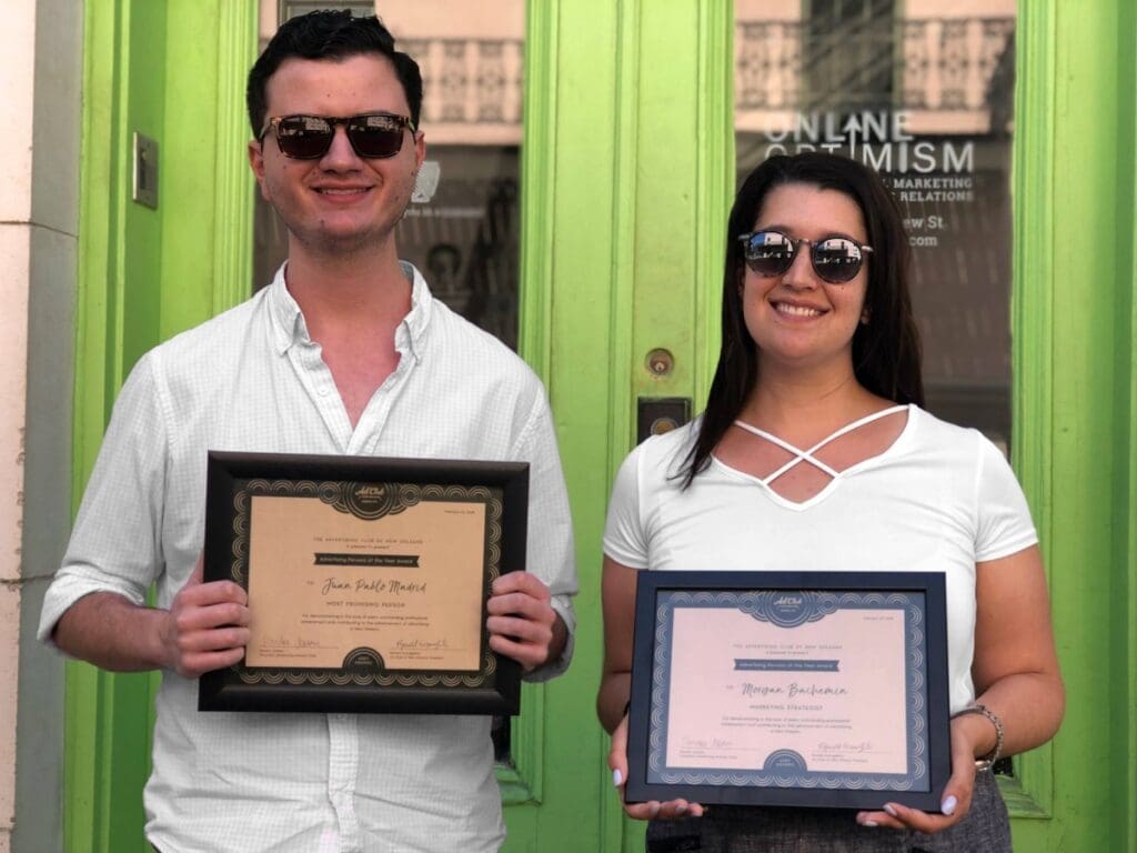 Juan Pablo Madrid and Mogan Bachemin hold their awards from the New Orleans Ad Club.