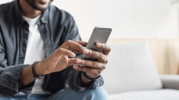 Young man using mobile phone. Business, communication, technology concept