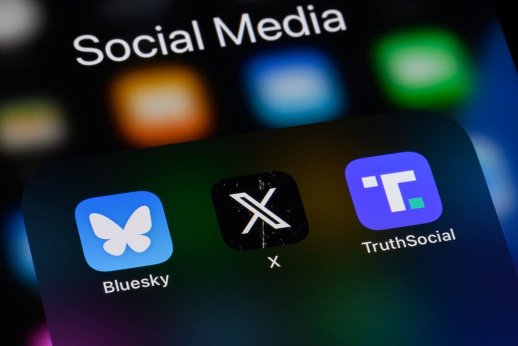 Social media apps on a smartphone - Bluesky, X (formerly Twitter), Truth Social.