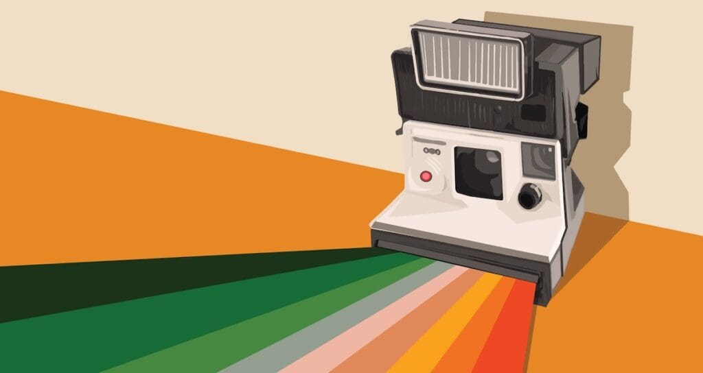 an image of a polaroid camera with colors coming out of it