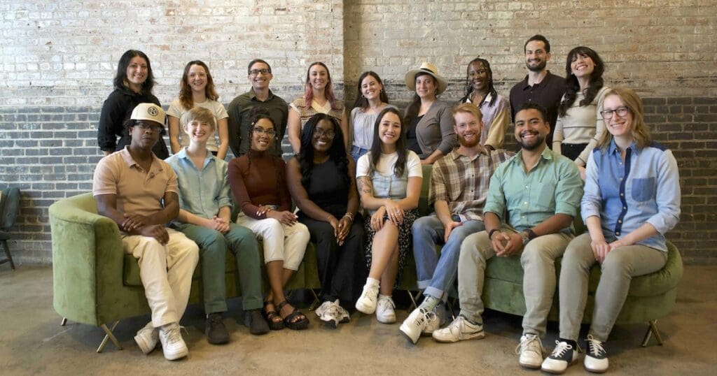 all of the optimists sitting on a couch together