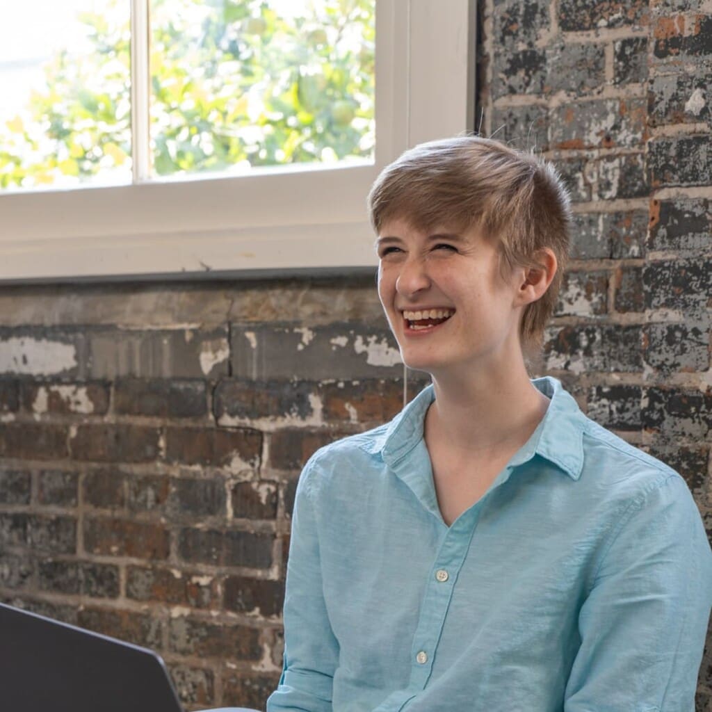 Ivey looks up from a laptop and laughs.