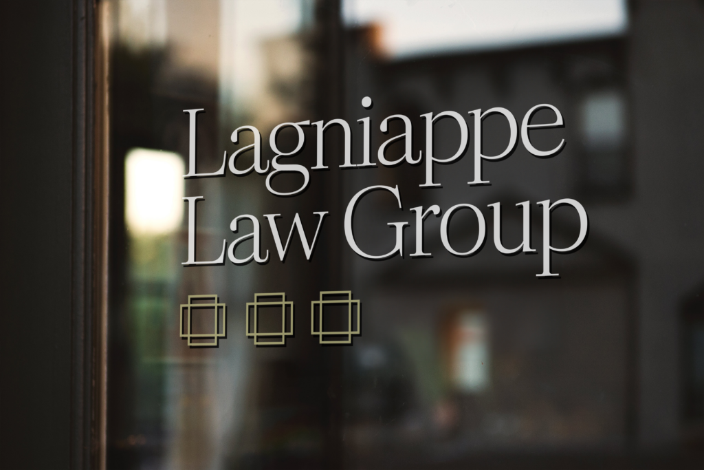 Lagniappe Law Group logo affixed to a glass office door