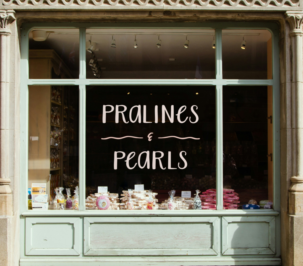 Pralines & Pearls logo on storefront window