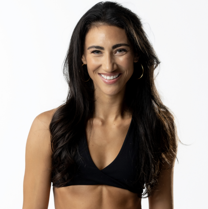 New Orleans influencer Ready Steph Go (Stephanie Weiss) grins at the camera, wearing a black sports bra.